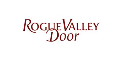 A red and white logo for rogue valley door.